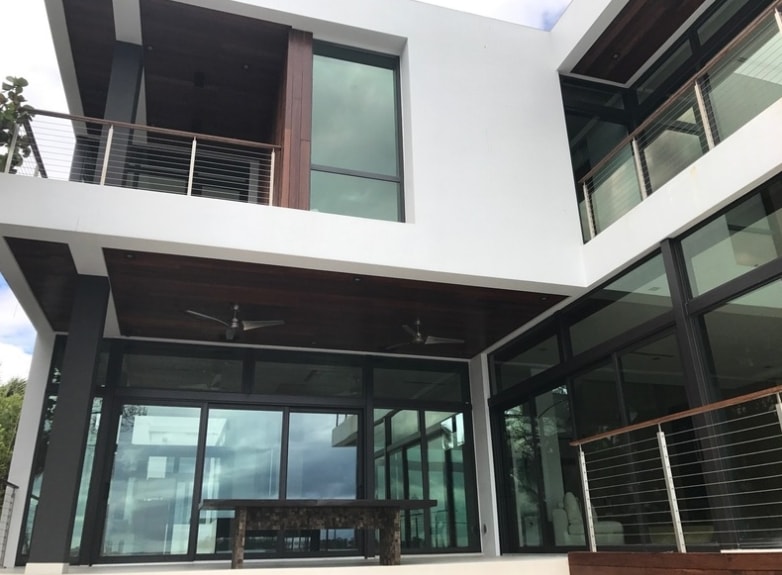 Contemporary home exterior with impact windows and modern landscaping