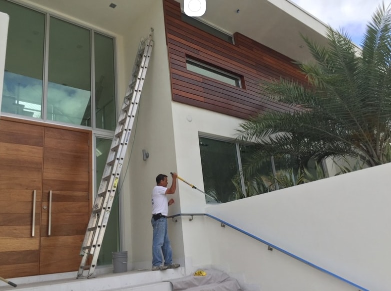 Modern residential building with impact windows and glass entry